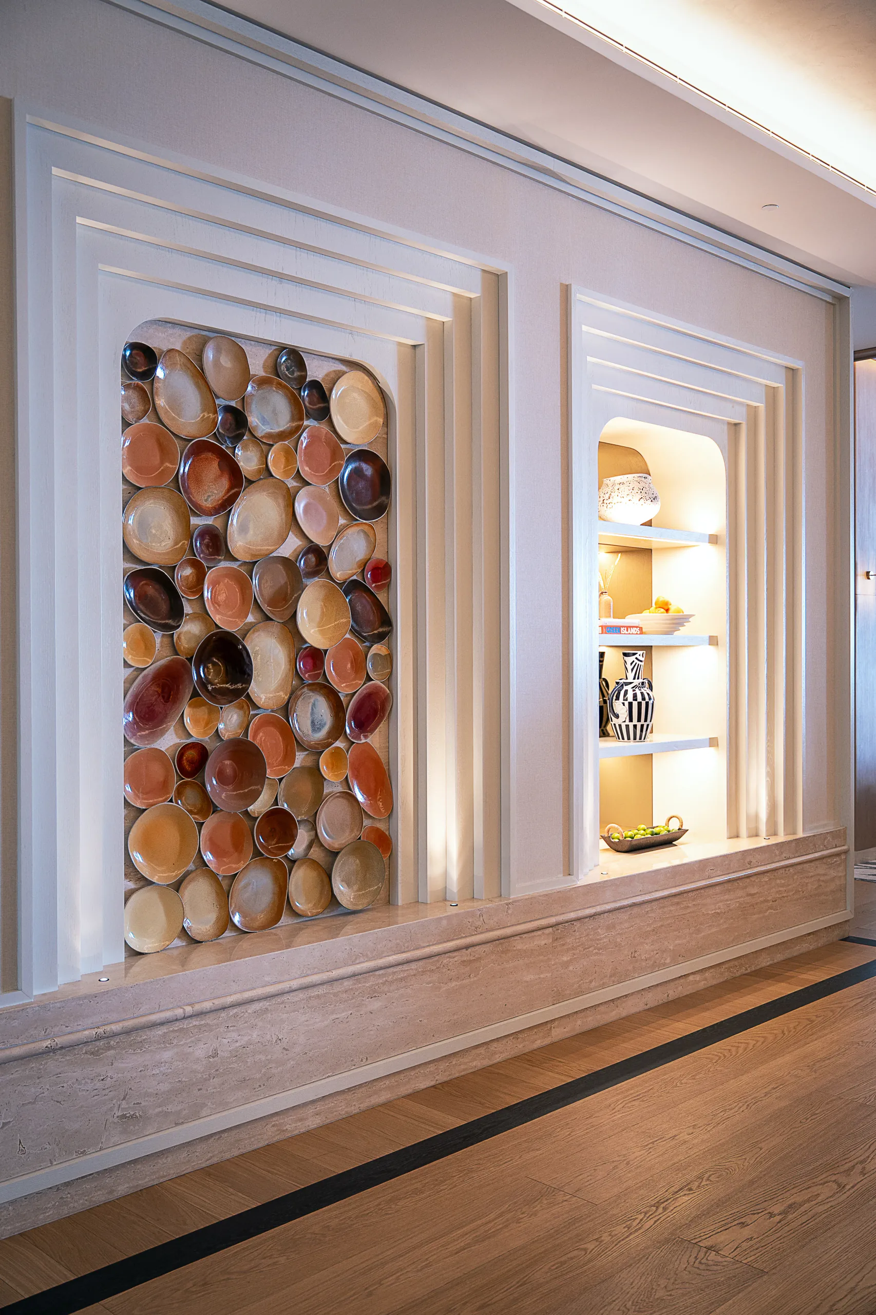 Ceramic installation and styled display niche at Iliana