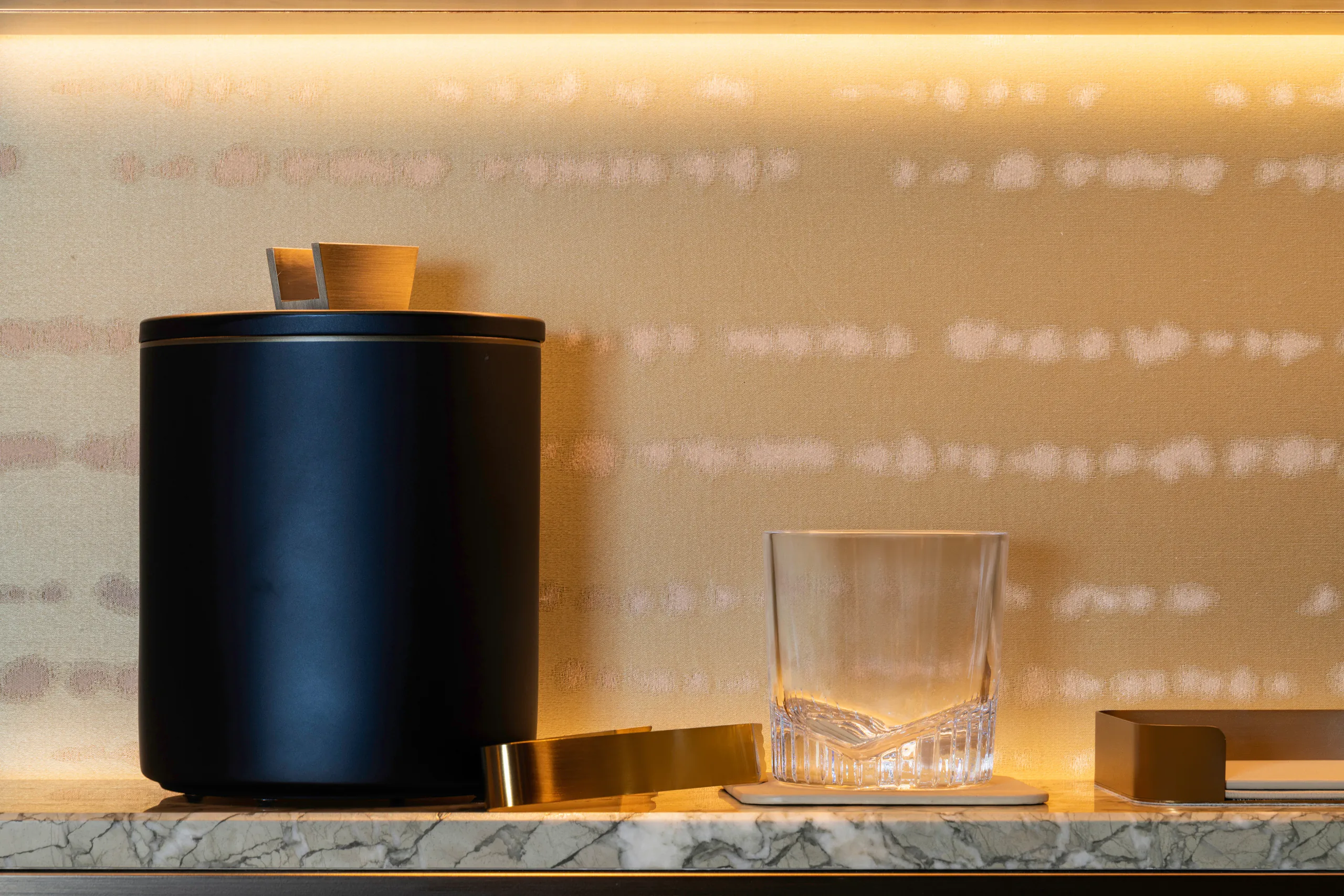 Dark vessel, glass and brass objects at Waldorf Astoria Osaka